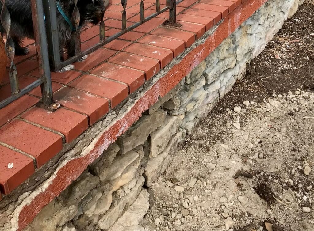Another side of the corner of the brick patio has even more crumbling foundation problems