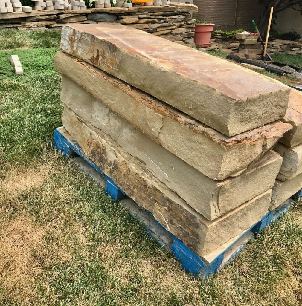 image of large chunky stone steps stacked on a pallet in the yard
