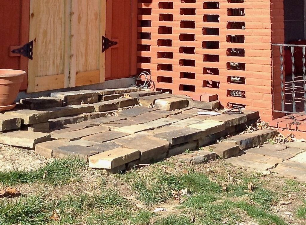 Close up of entry into shed of stacked wobbly stones