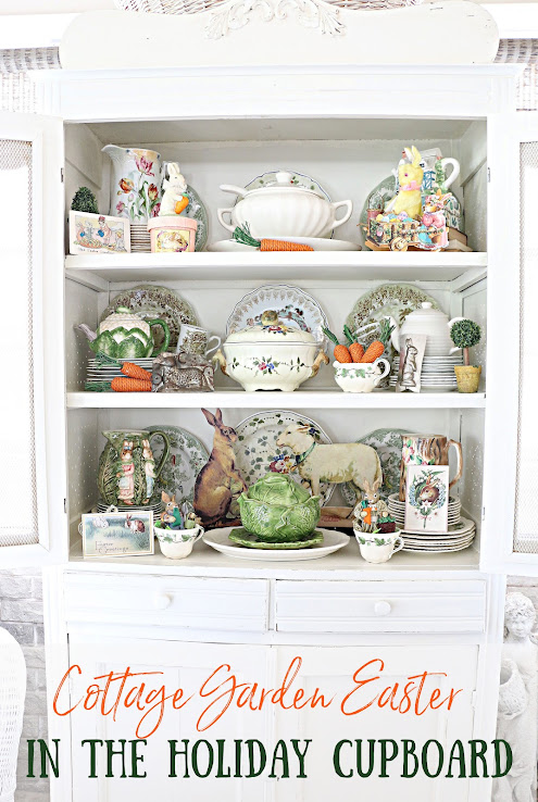 a hutch with the shelves filled with easter themed dishes and statues