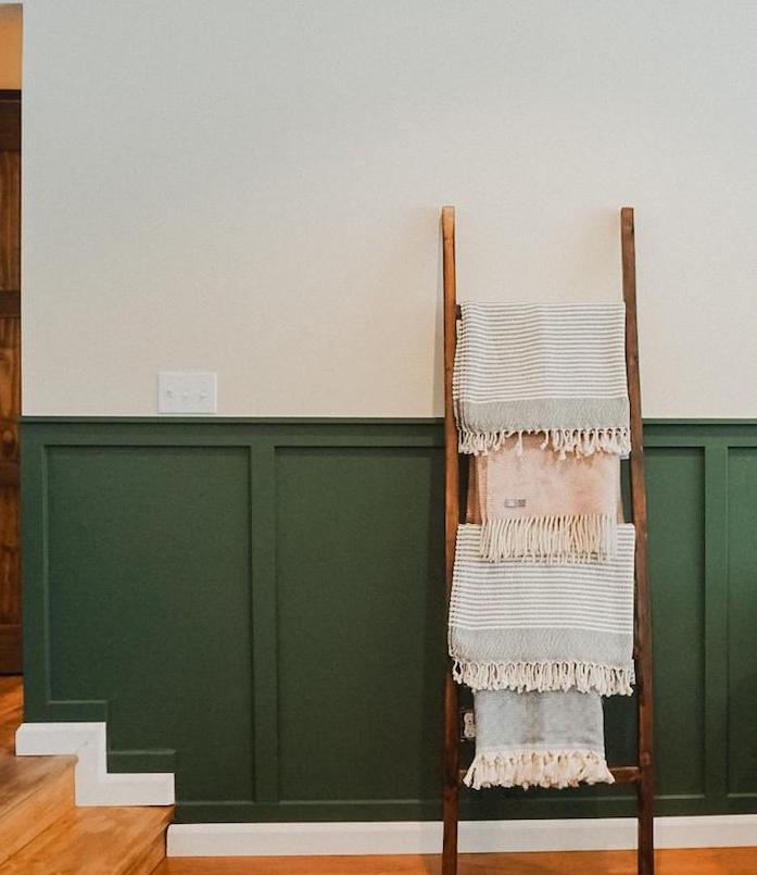 image of a wood accent wall with the accent installed above the original moulding and transitioning with each stair step