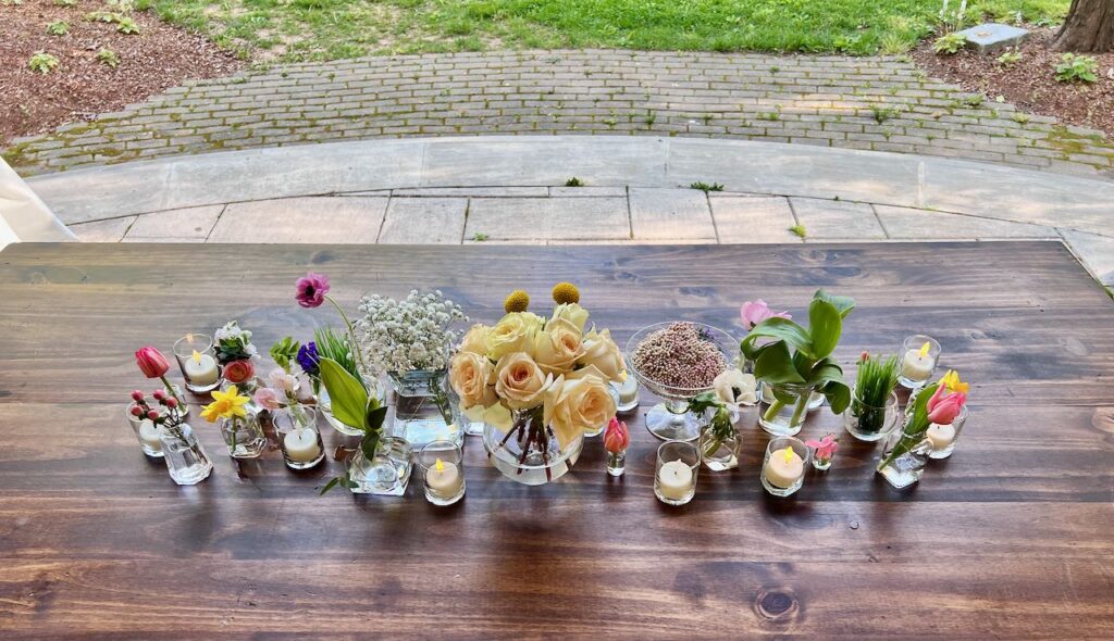 An overhead view of the bridal table with the finished cluster arrangement