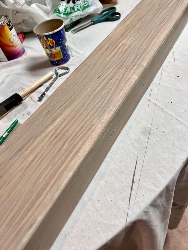 closeup of one leg. beam with base coat of glaze