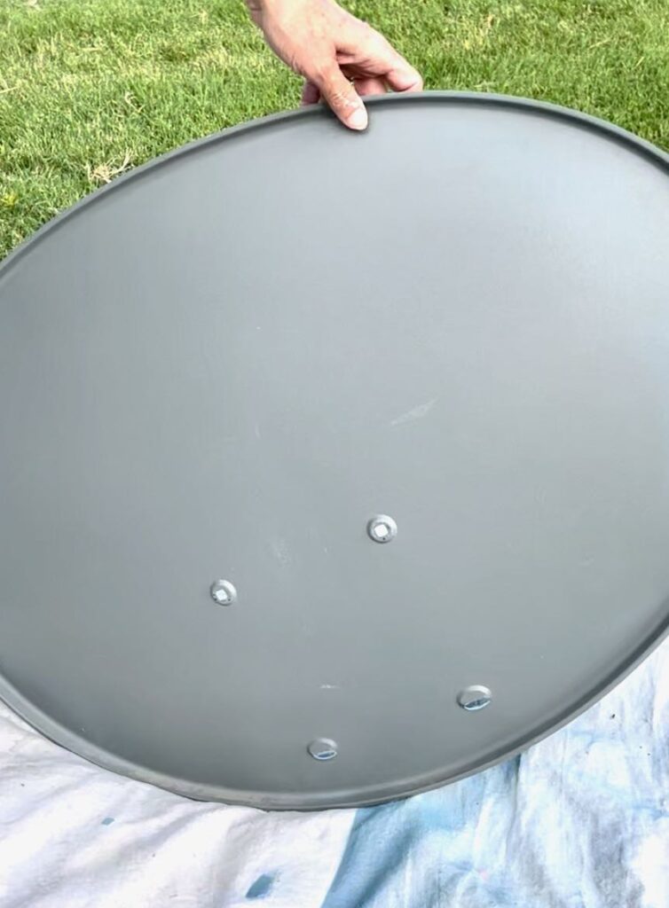 the back of a satellite dish with all hardware removed
