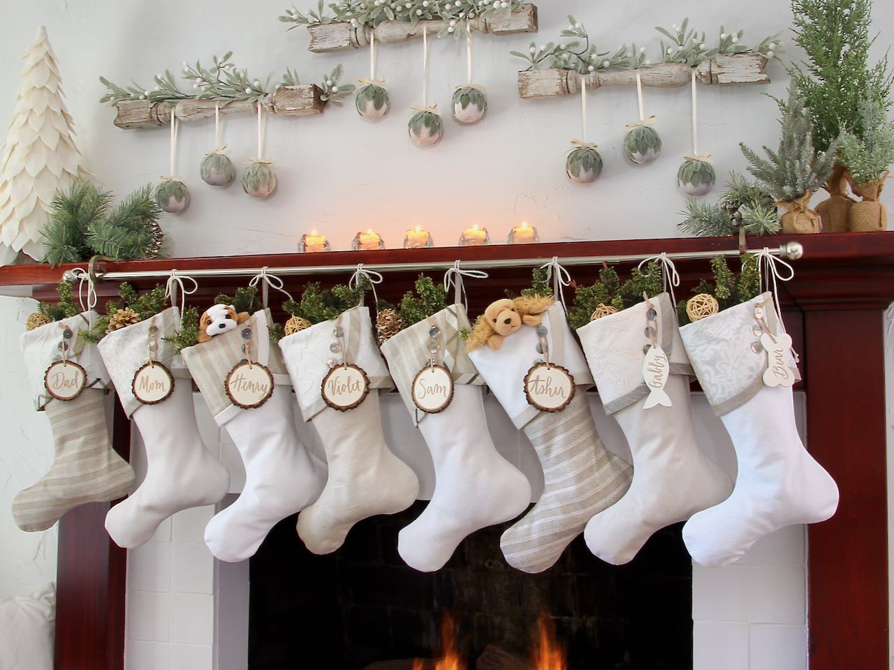 set of 8 modern farmhouse Christmas stockings with white tree slice name tags