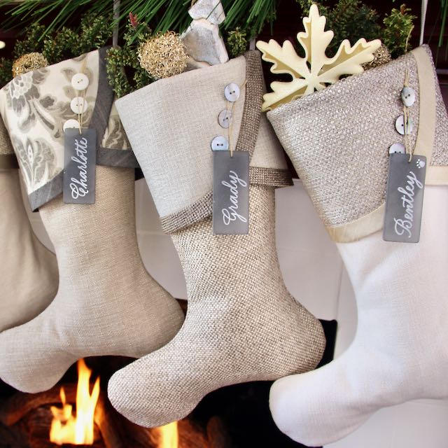 Closeup of 3 Neutral Christmas Stockings with sea glass name tags