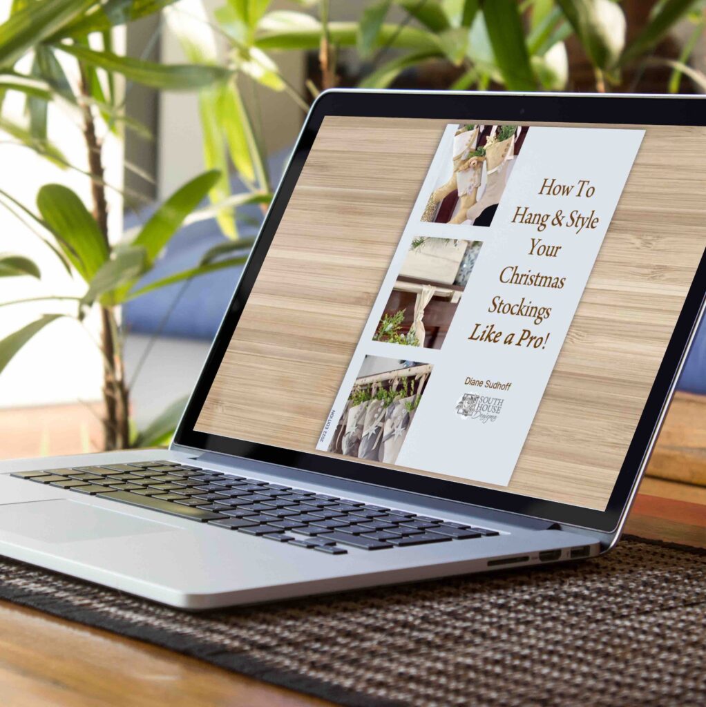 a laptop is open on a desk with the cover of an ebook on the screen