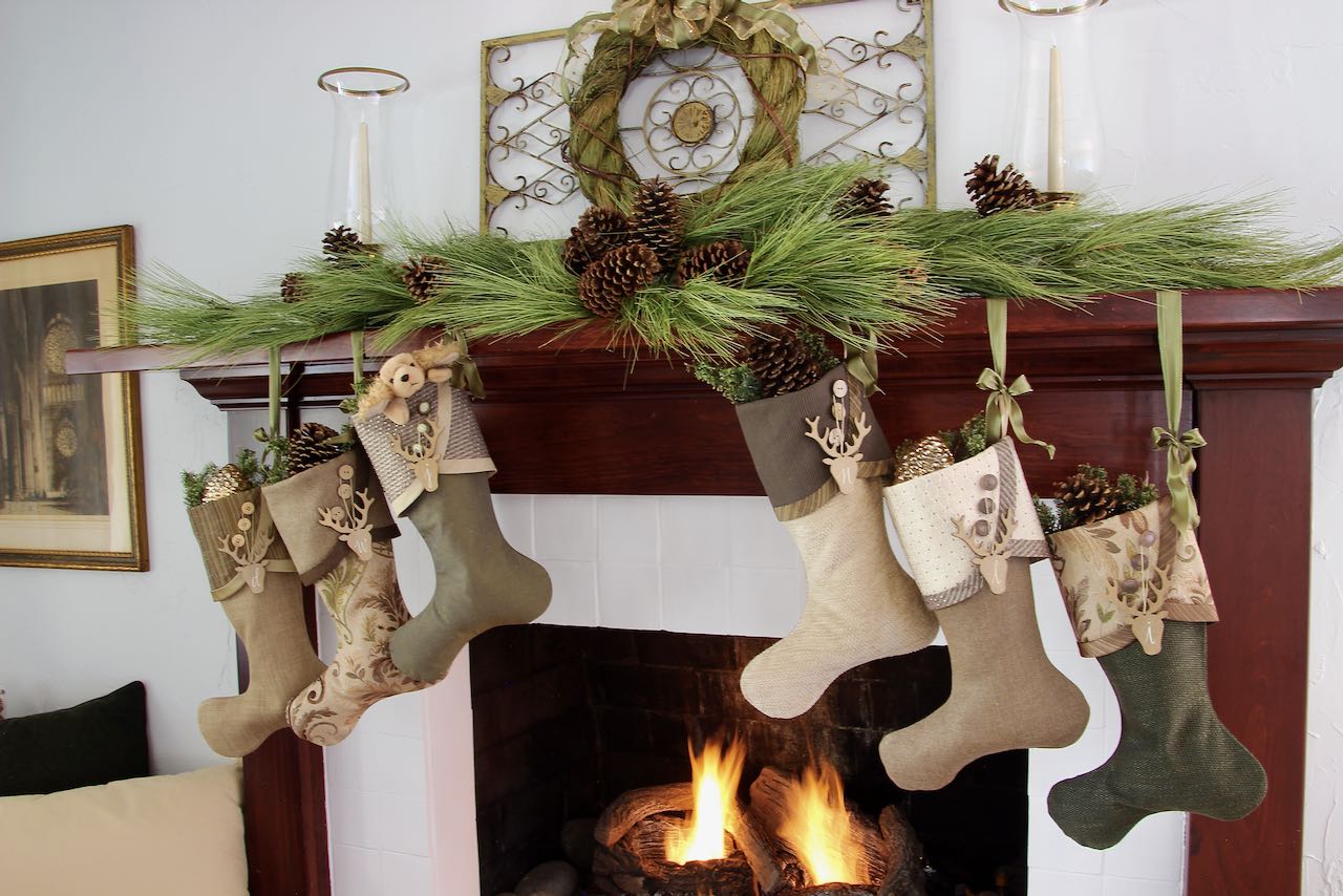 Wide view of mantel display with 6 stockings