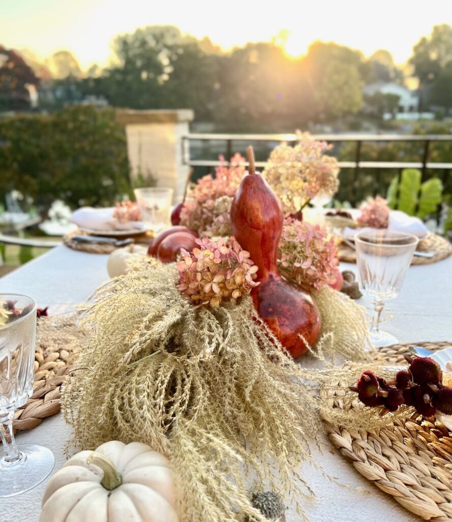 sunrise breaking over a fall tablescape overlooking a lake
