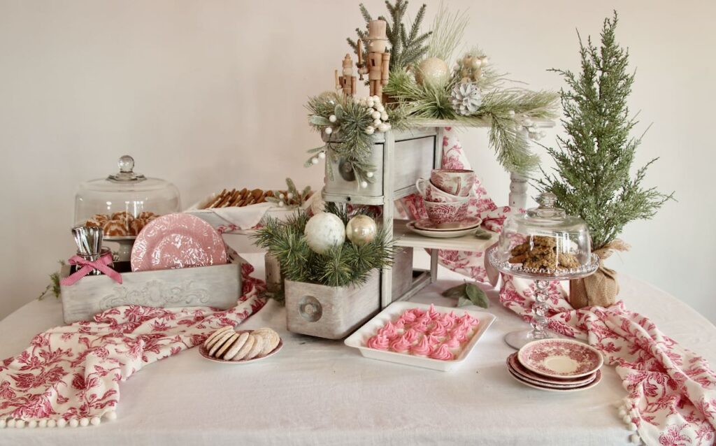 finished Christmas cookie display holding trays and plates of different Christmas cookies