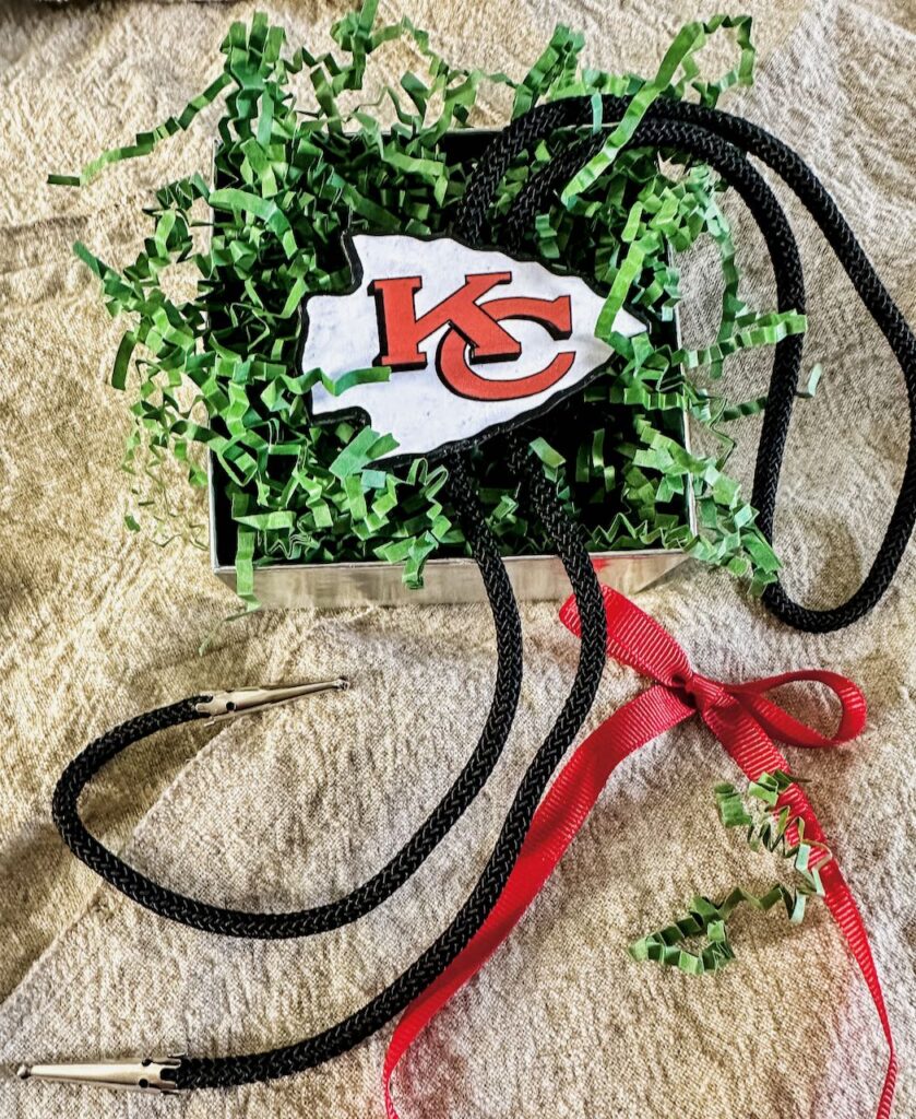 https://southhousedesigns.com/wp-content/uploads/2022/11/Chiefs-Bolo-Tie-christmas-cheer-839x1024.jpeg