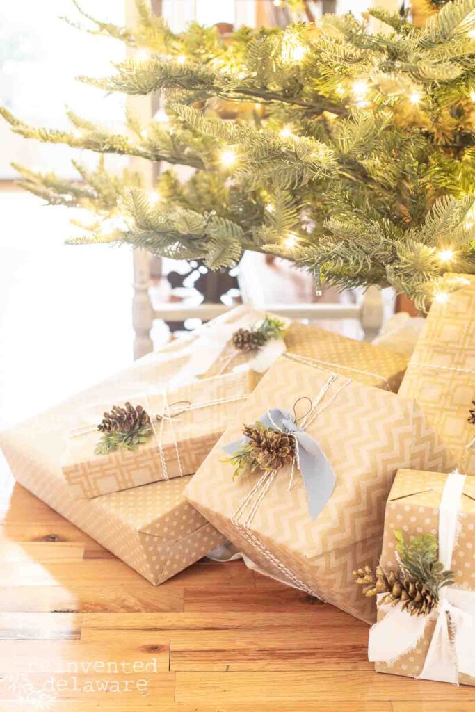 Packages under a Christmas Tree with pine cone embellishments