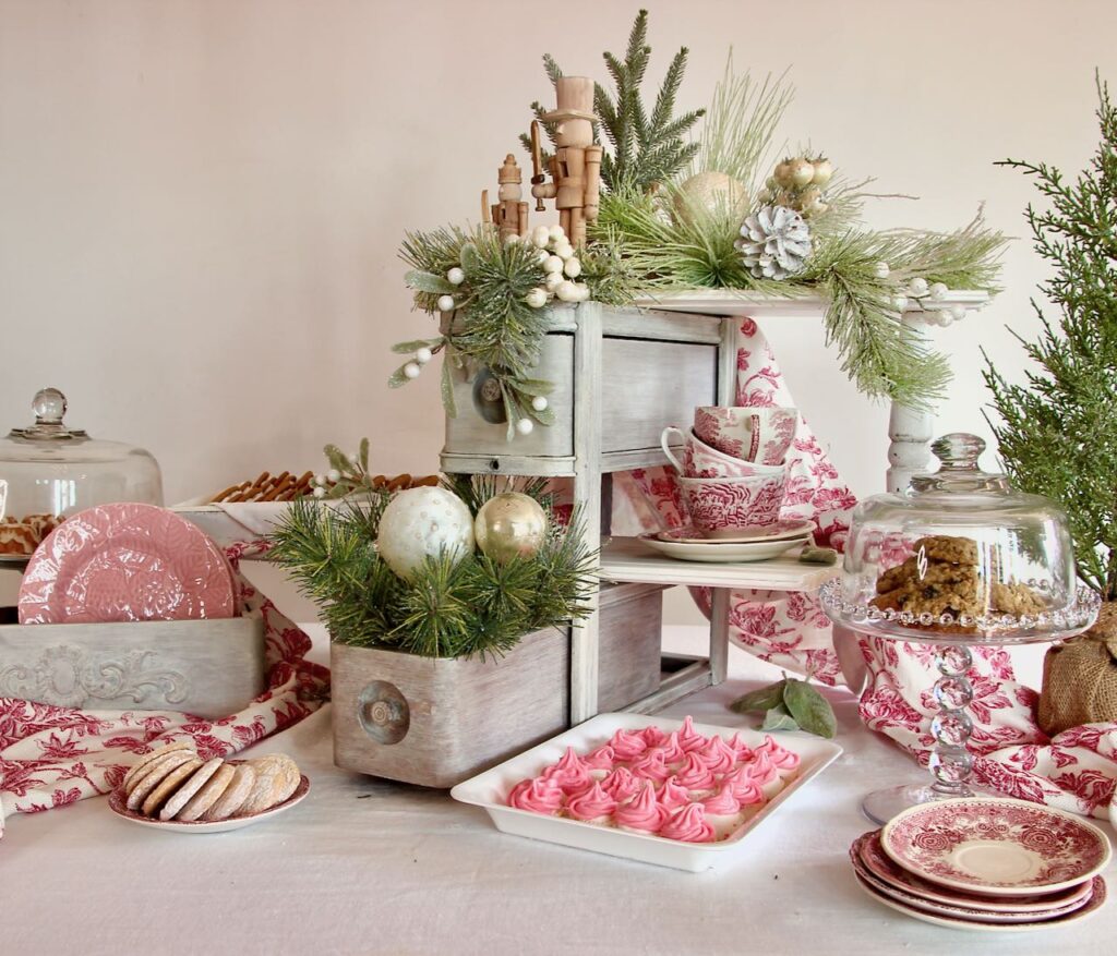 finished Christmas cookie display holding trays and plates of different Christmas cookies