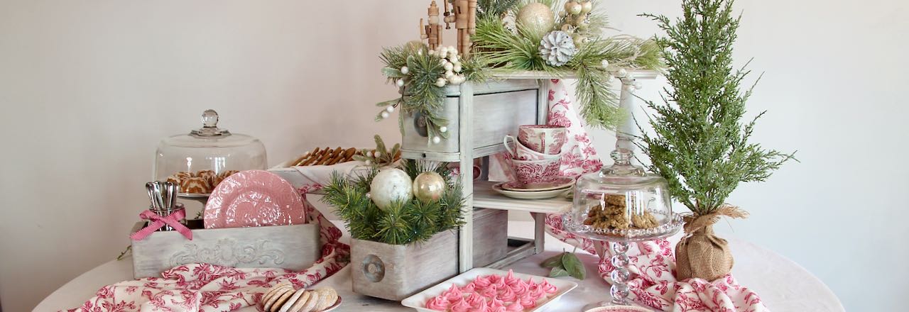 Closeup wide view of the finished Christmas cookie display featuring a vintage sewing cabinet drawer set