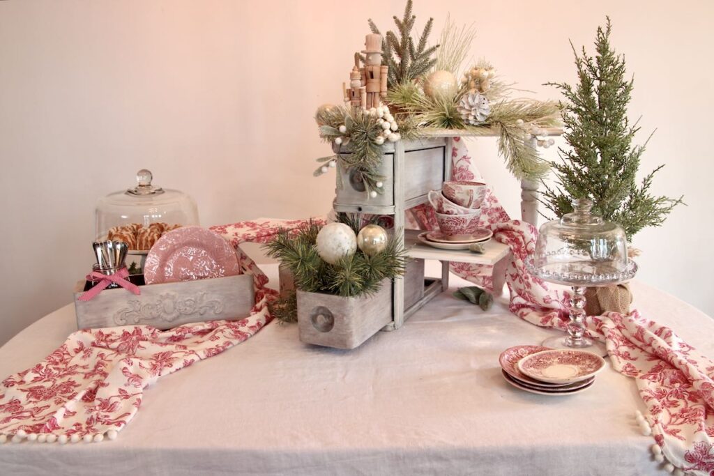 Display made with vintage sewing drawers with two shelves decorated with Christmas decor