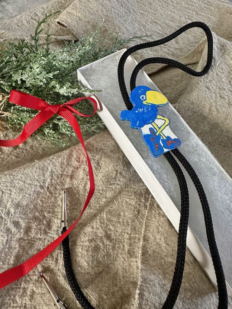 a logo bolo in an opened gift box