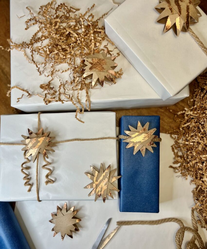 flat lay view of bowes gift wrapped with the decorative stars tied on