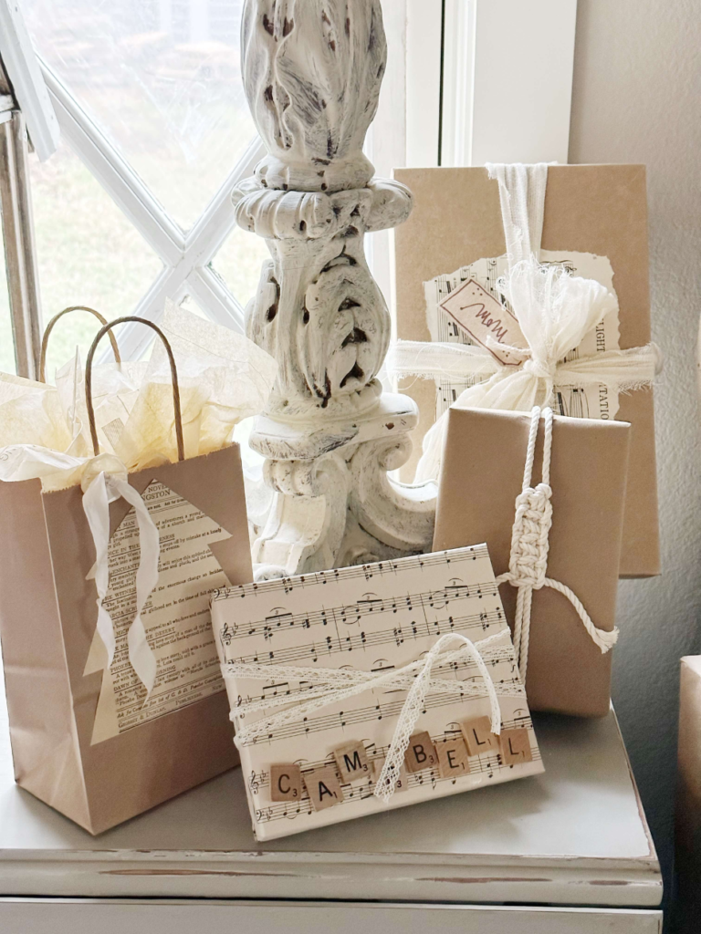 gifts wrapped with brown paper bags and sheet music and book page embellishmen