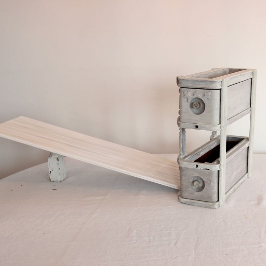 vintage sewing drawers as a display with one shelf ready to be added