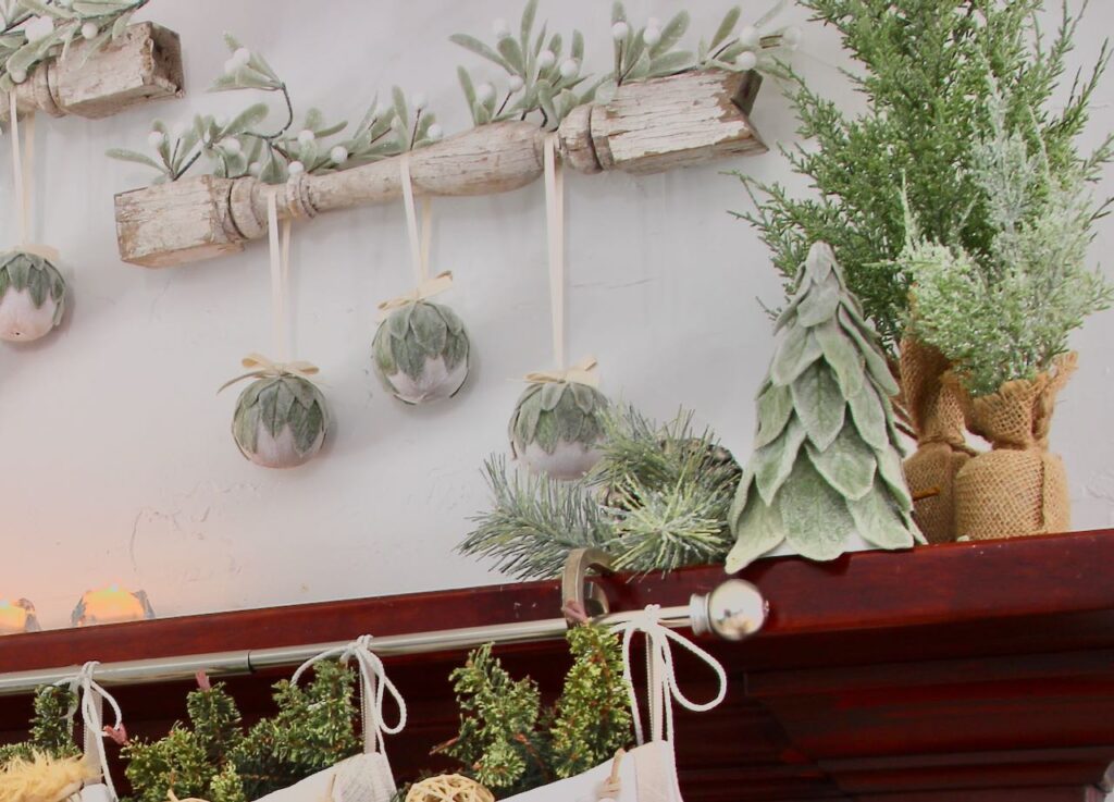 original small lambs ear tree on a mantel as part of a larger display