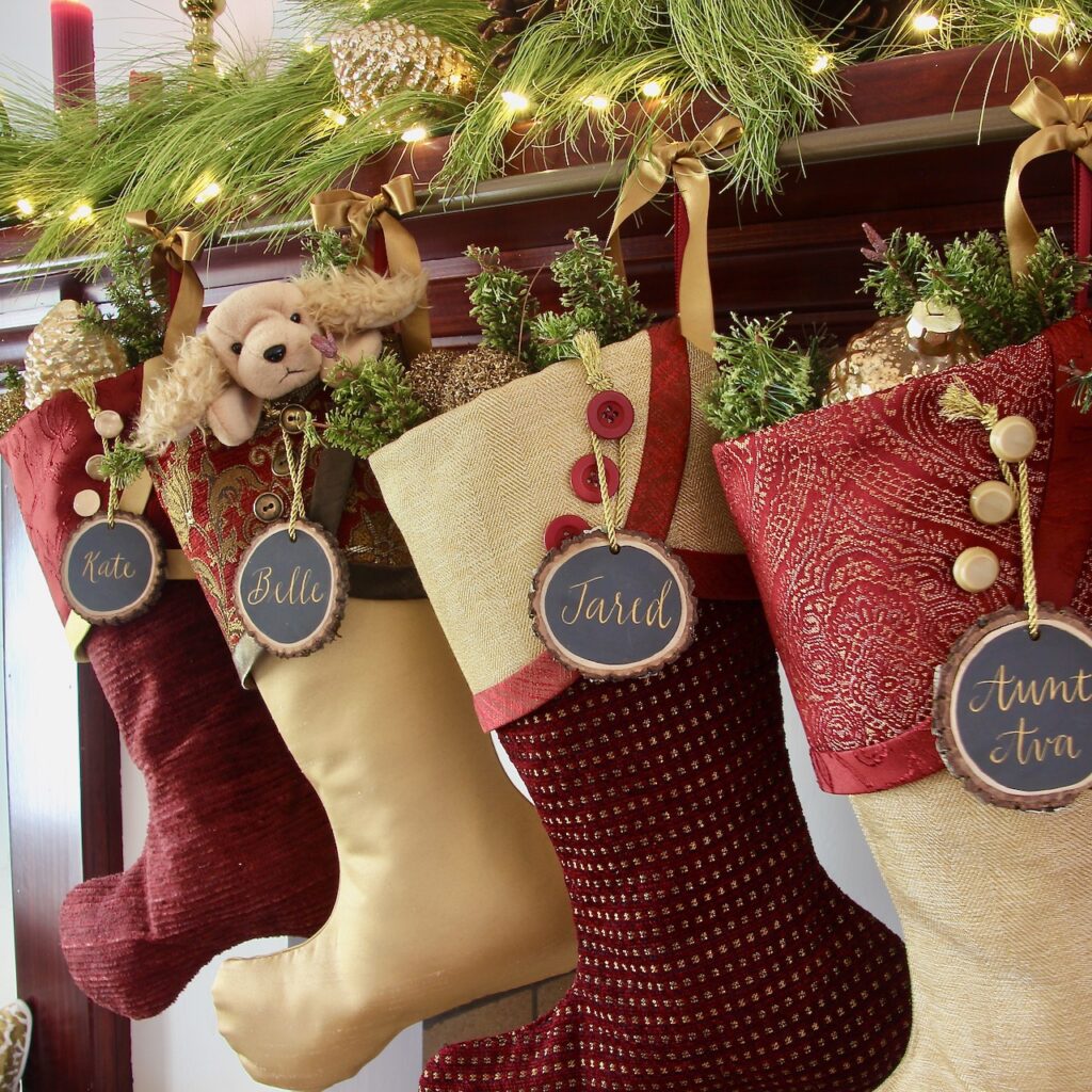 Four Stockings are tied onto the stocking rod with satin ribbon