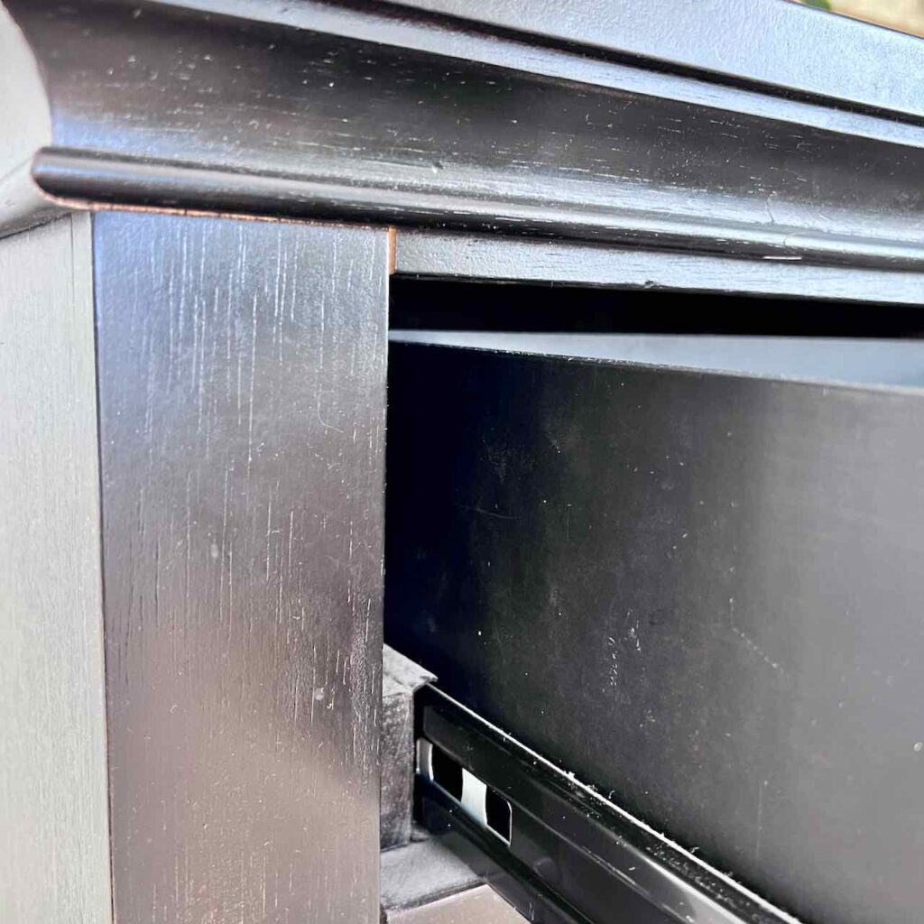 closeup showing the gap between the drawer box and the dresser frame