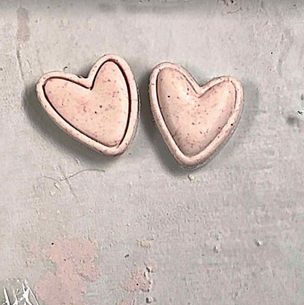 two small hearts side by side showing the difference between being cut with plastic and no plastic wrap