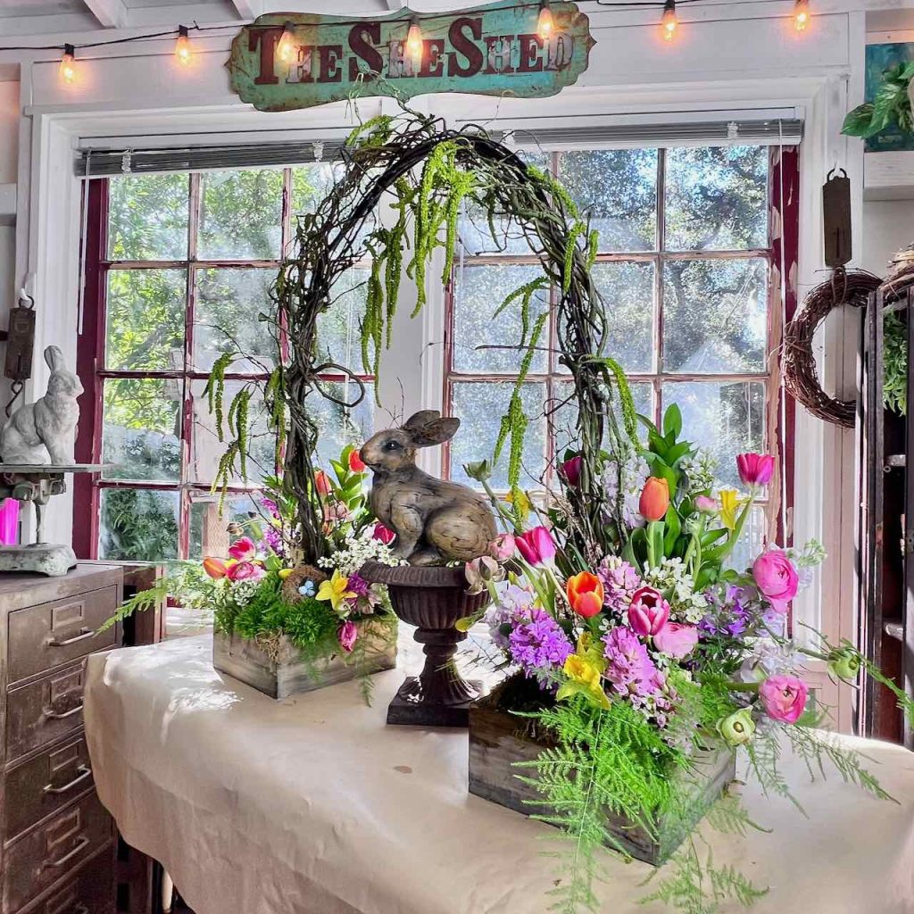 Final Arrangement on the work table in front of bright sunny windows with a She Shed sign