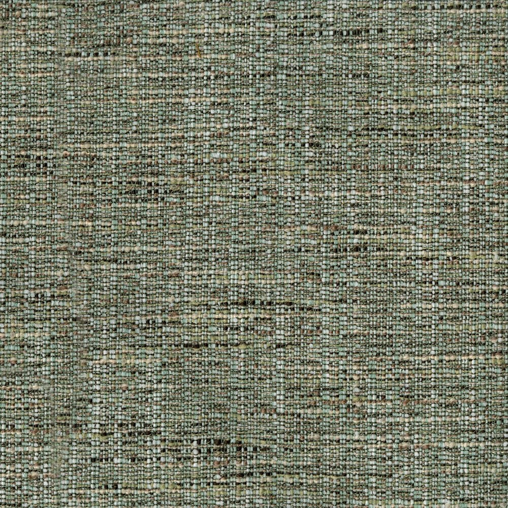 Close-up of a woven fabric with a textured pattern in muted shades of green, brown, and gray, showing the dense and intricate interlacing of threads on an upholstered backrest and bench cushion.