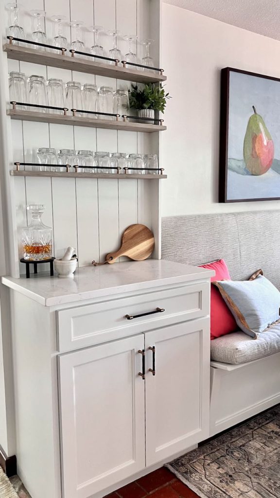 floor to ceiling view of the finished cabinet dry bar with open shelves