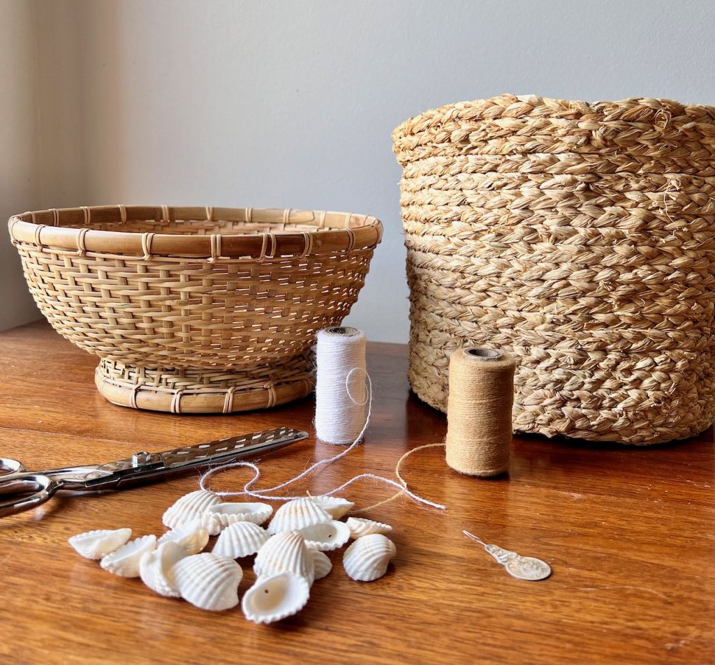 supplies needed for shell trimmed basket on a wood table top