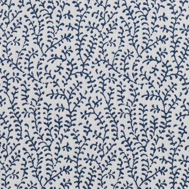 White fabric with a repeating pattern of small, dark blue leafy branches covers the upholstered backrest and bench cushion, creating a dense, organic, and botanical design.