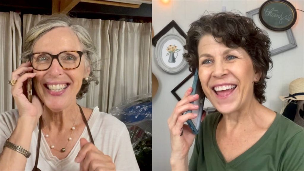 Two women laughing and talking on the cell phones