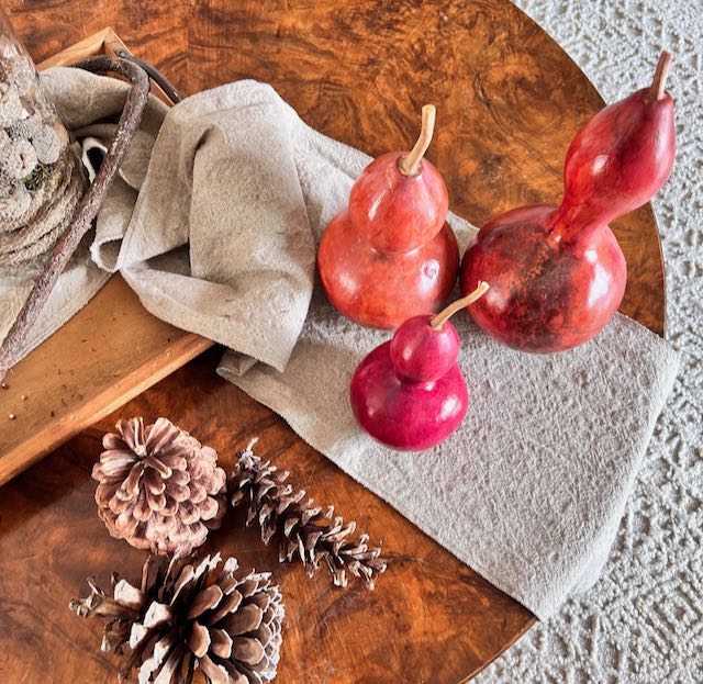 overhead view of supplies used in the colored gourd Fall arrangement