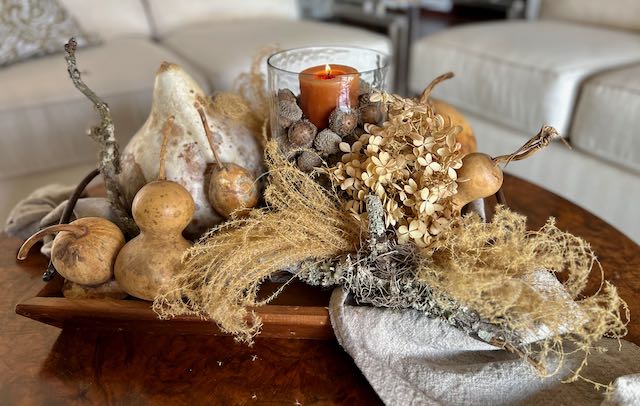 Natural gourds , pampas grass and dried hydrangeas make a gorgeous fall floral arrangement