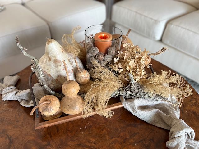 Natural gourds , pampas grass and dried hydrangeas make a gorgeous fall floral arrangement