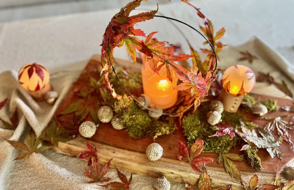 Leaf orb, glowing orb and leaves displayed on a large bread board