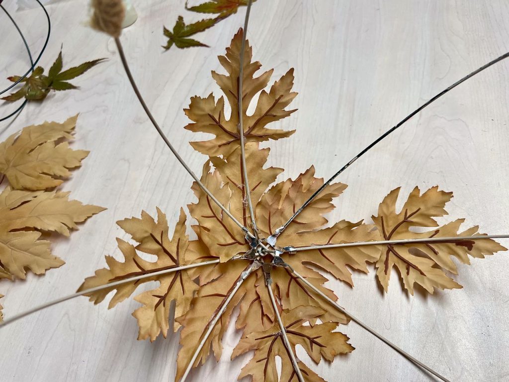 inside of large globe showing the underside of four leaves in place