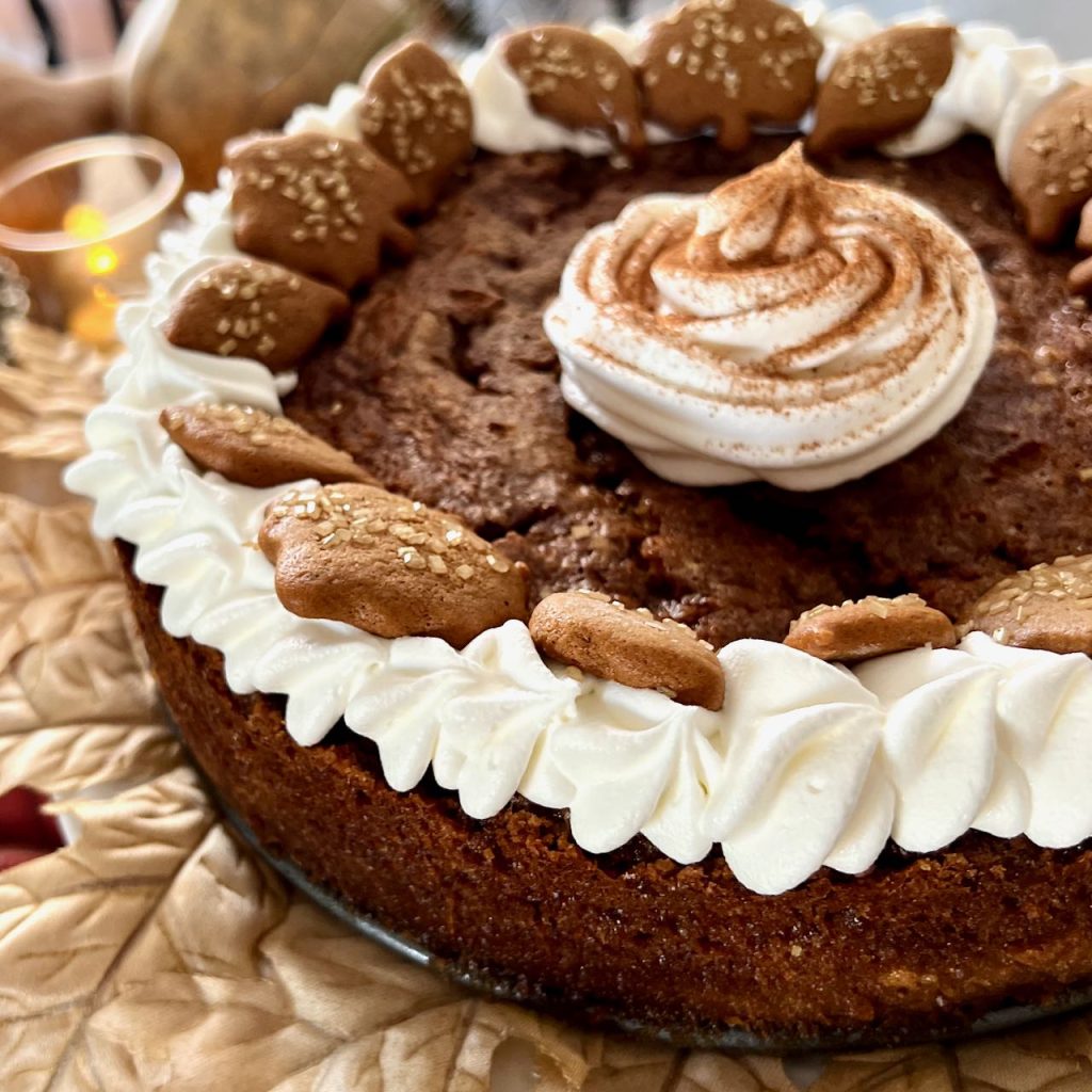 Closeup of a whole eggnog  custard pie with whipped cream