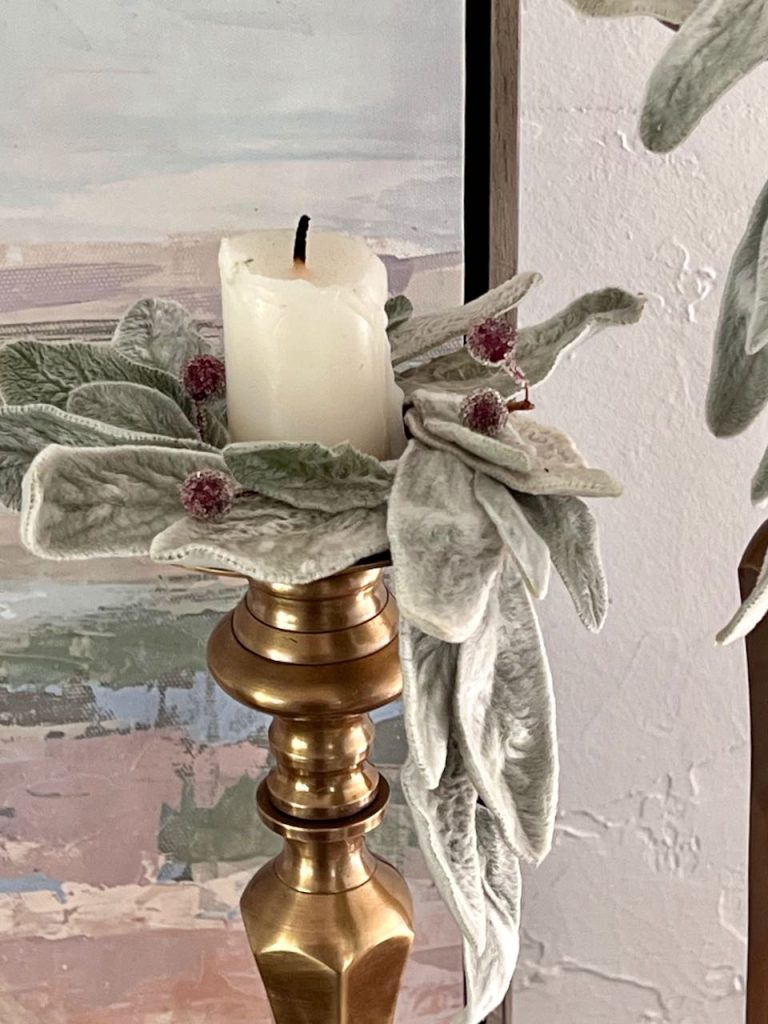 Closeup of a fresh lambs ear candle ring on a tall candlestick