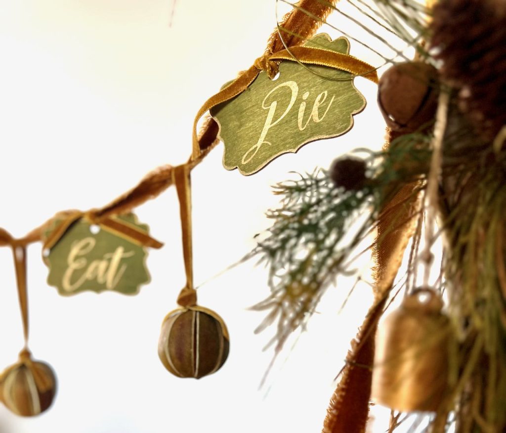 closeup of garland signs that say Eat Pie