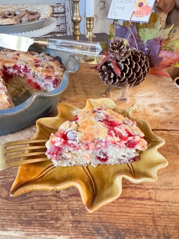 Slice of Cranberry Dump Cake is in a leaf-shaped dish