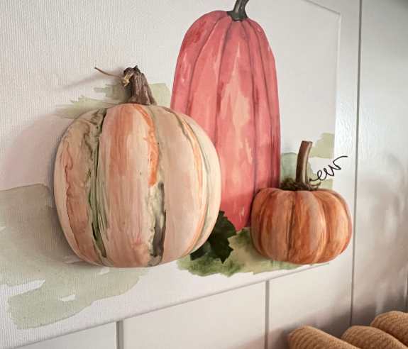 Cover image of pumpkin art on the backboard of a dry bar behind the title of South House House Mates