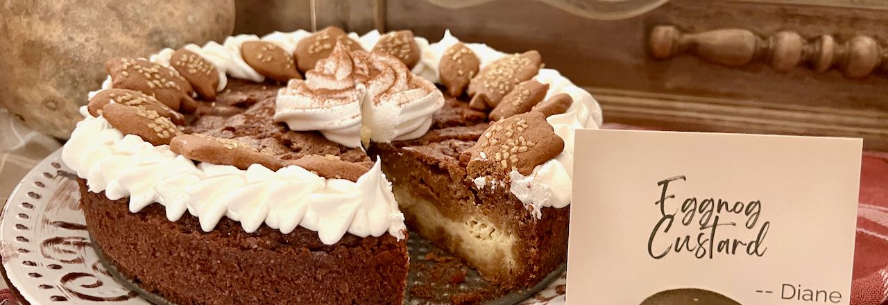 wide closeup of eggnog and gingerbread pie with a slice cut out and an ID card beside it