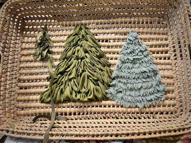 a third tree of strips of fabric is shown partially added to the basket