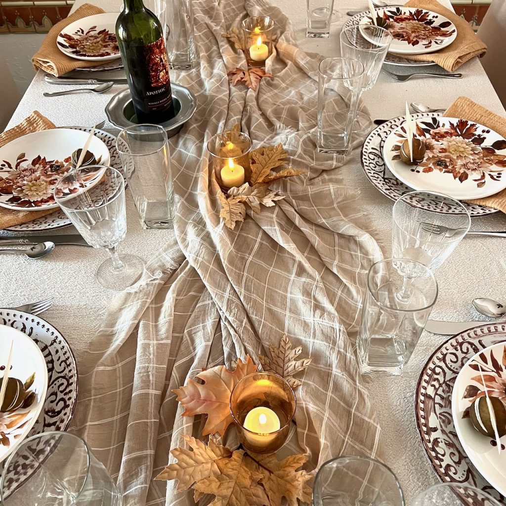 view down length of table with tablesettings complete with glasses and flatware