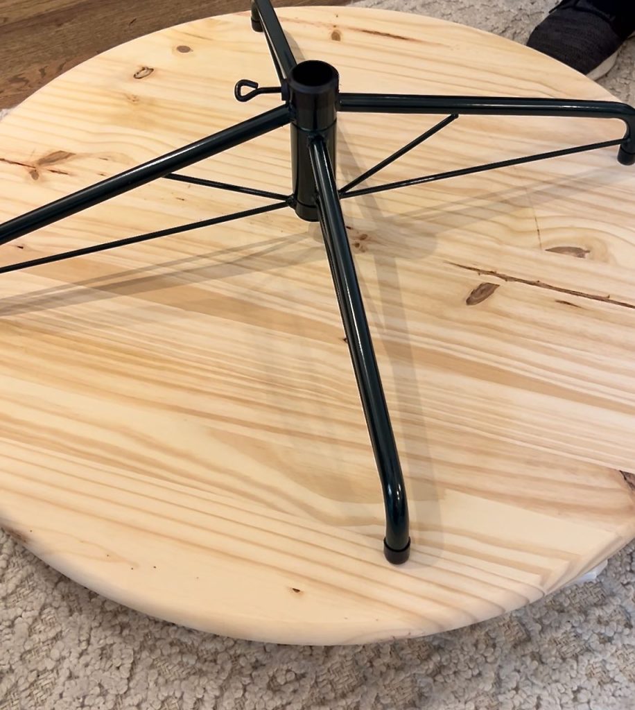 close up of an empty tree stand on an elevated round wood board