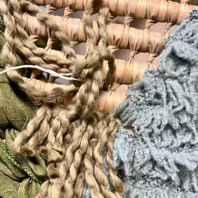 closeup of yarn with a twist tie around it