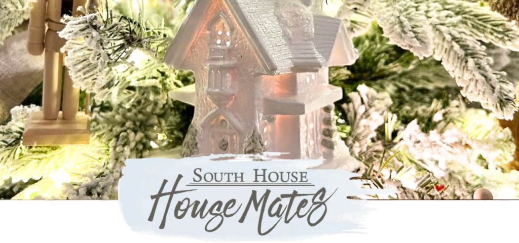 Closeup of Ceramic House on Tree behind House Mates logo