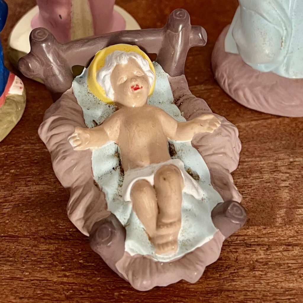Closeup of baby Jesus as found in a thrift store